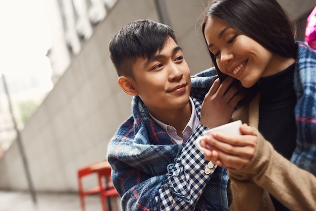 Asian Boy Taking Care of Attractive Girlfriend.