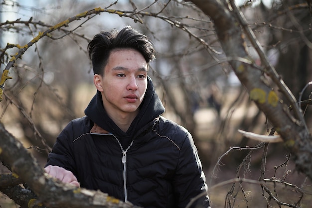 Asian boy teenager in nature season cold weather