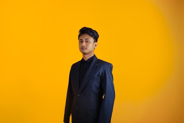 asian boy wearing suit with serious look