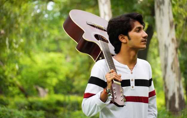 Asian boy with beautiful guitar