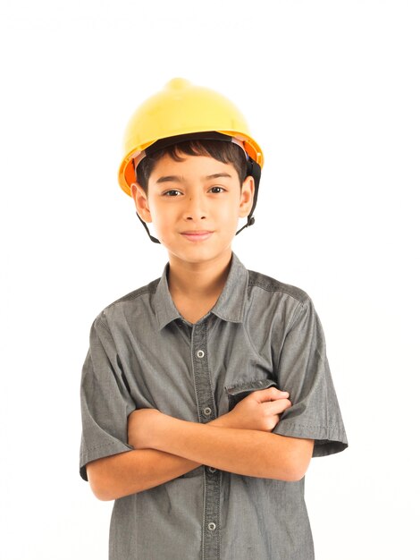 Asian boy with engineer and safety yellow hat on white background