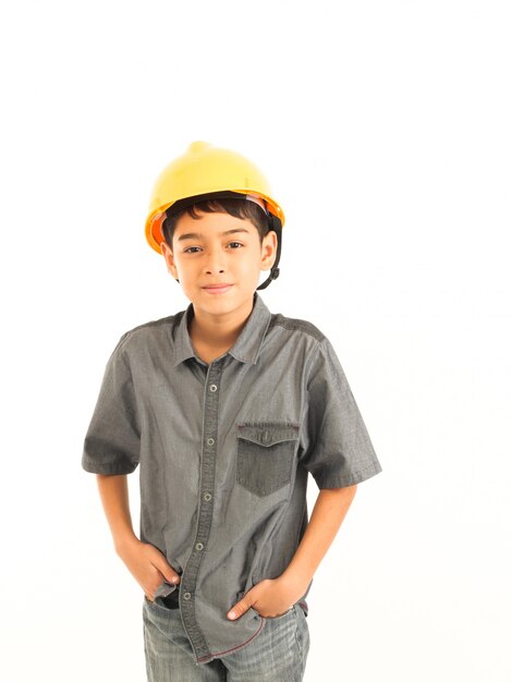 Asian boy with engineer and safety yellow hat on white background