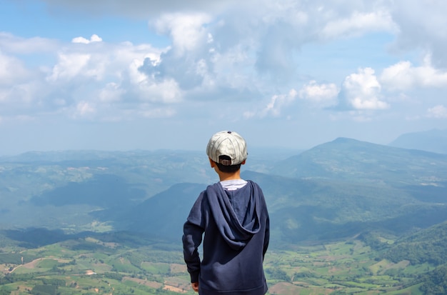 Asian boys see the mountains and the sky at Phu Rua National Park in Loei.