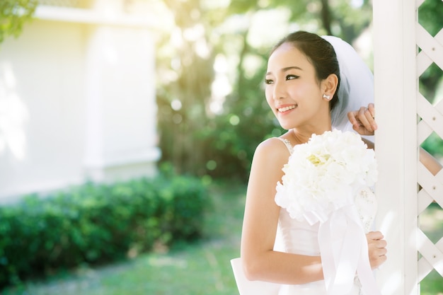 Asian bride outdoors in a morning.