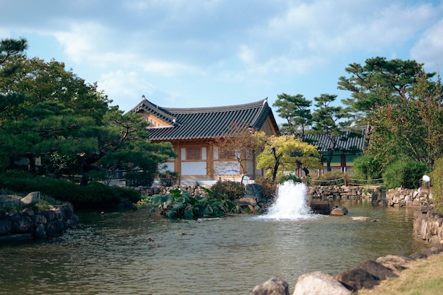 An Asian building beside a pond