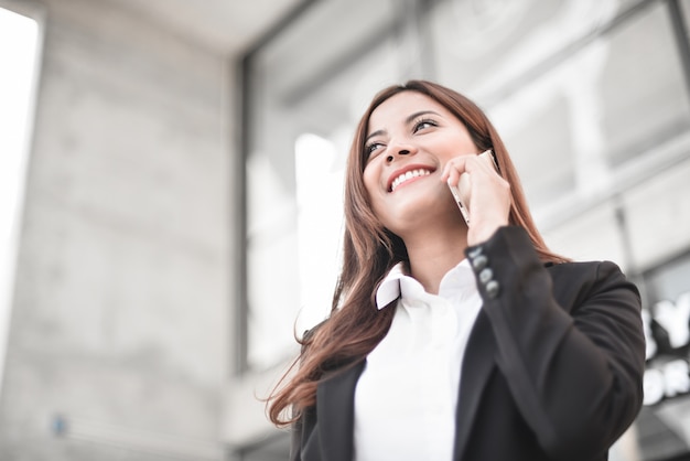 Asian business girl with smart phone