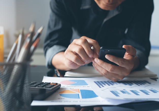 asian business man working at office with business document on table