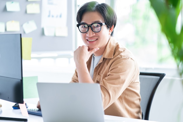 Asian business man working with computer in office