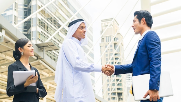 Photo asian business people smart shaking hands