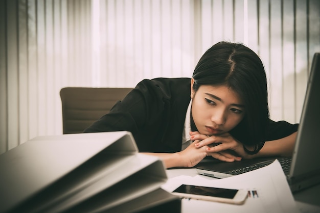 Photo asian business tired from workworker relax from work on the deskthailand people