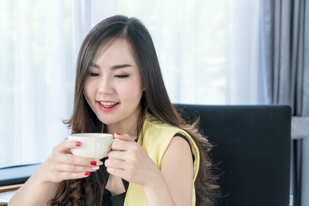 asian business woman happy with coffee cup 