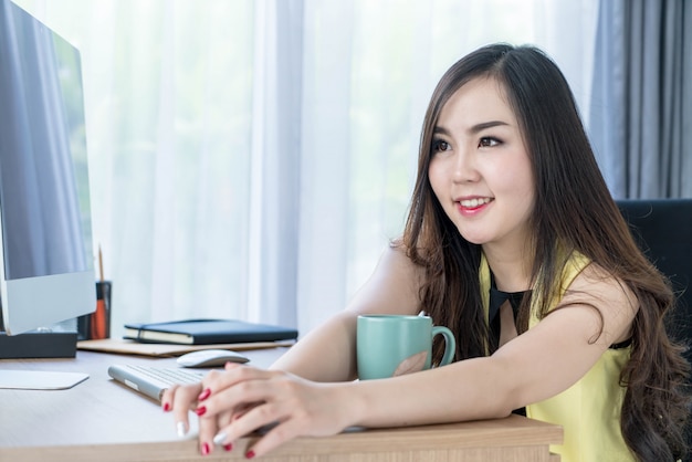 asian business woman happy with coffee cup 