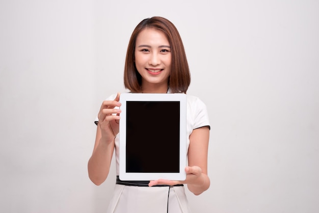 Asian business woman holding ipad tablet