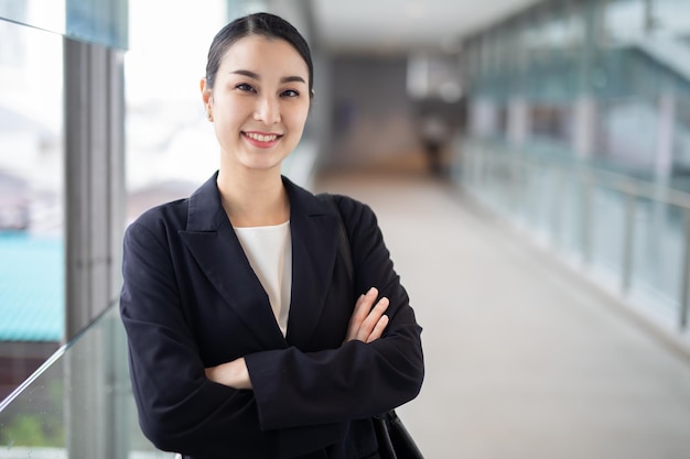 Asian business woman smiling looking camera, Fashion business photo of beautiful girl in casual suit