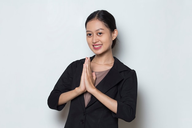 Asian business woman welcoming guests gesture