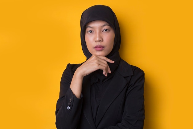 Asian Business woman with hijab portrait thinking, feeling doubtful and confused