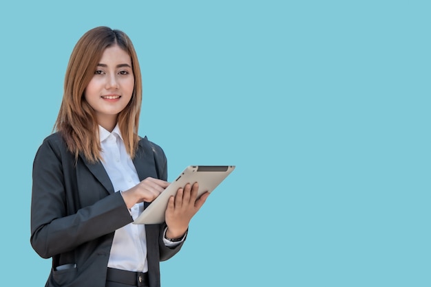 Asian business woman with tablet computer isolated on blue banner