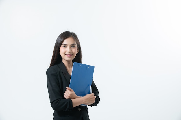 Asian business women are smiling and holding with clipboard  for working happy  