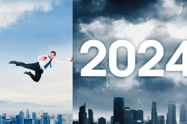 Asian businessman is changing the economic or financial year from bad to good in year 2024