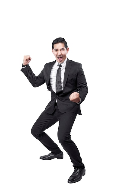 Asian businessman standing with successful expression