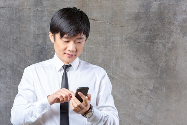 Asian businessman talking on mobile cell phone