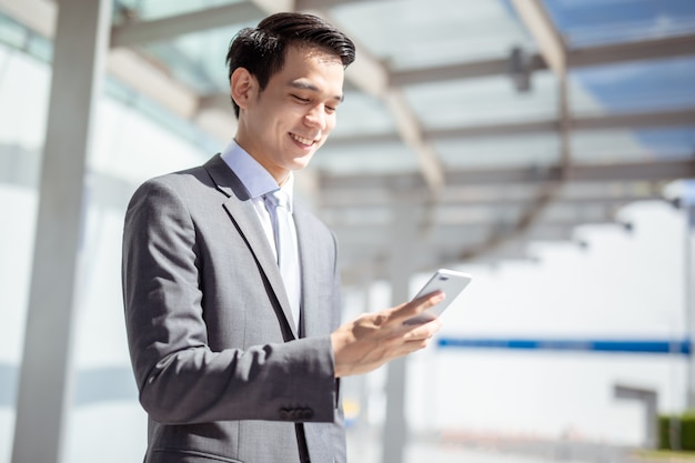 Asian businessman using a smartphone