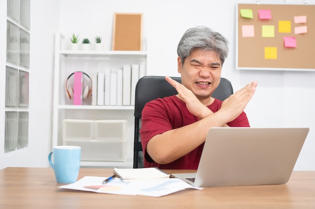 Asian businessman video conference calling on laptop for an online learning education at home.