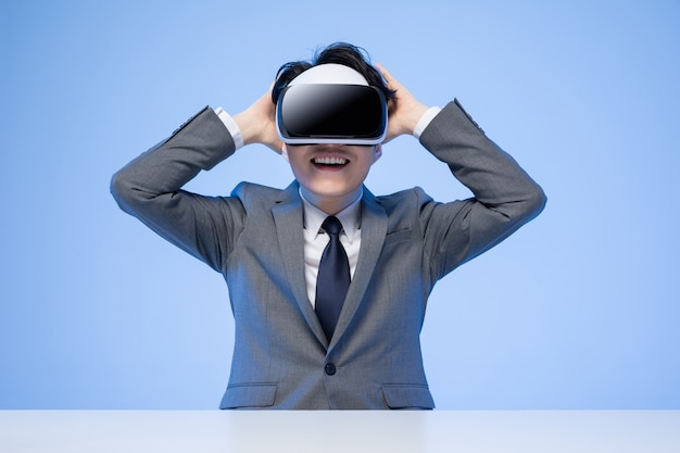 Asian businessman with VR glasses