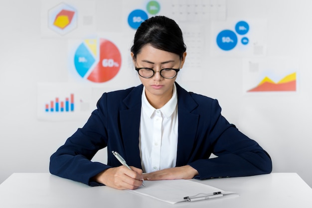 Asian businesswoman pay attention while working