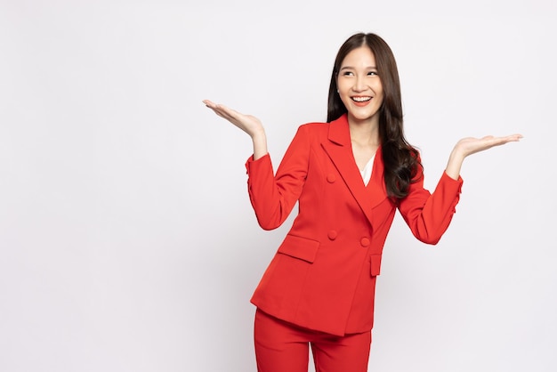 Asian businesswoman showing open hand palm isolated over white background