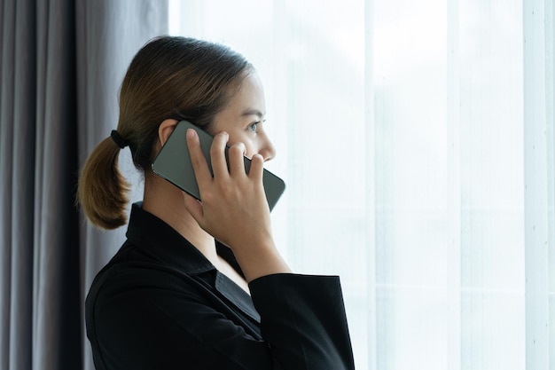 Asian businesswoman talking on mobile phone