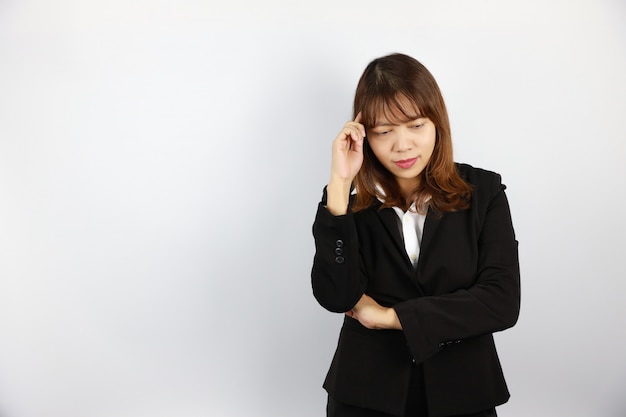 Asian businesswoman thinking something with confident face on white