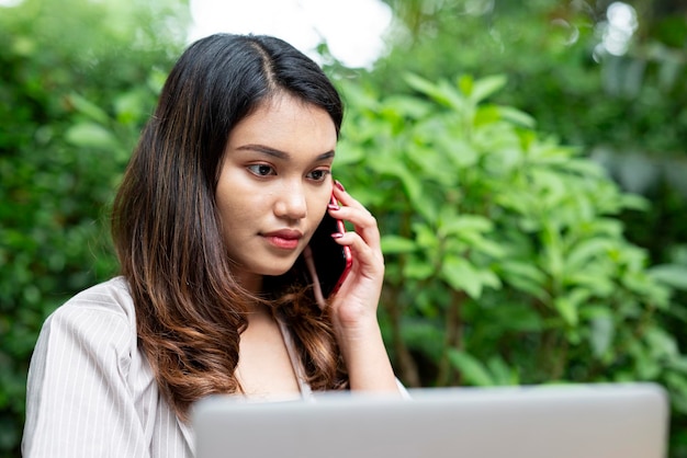 Asian businesswoman using a mobile phone