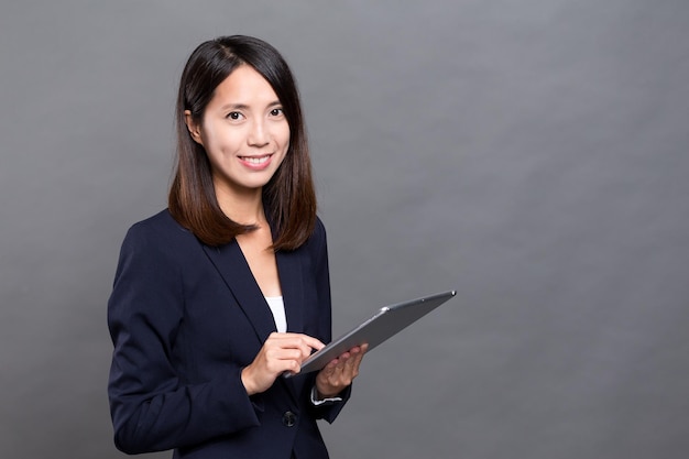 Asian businesswoman using tablet computer