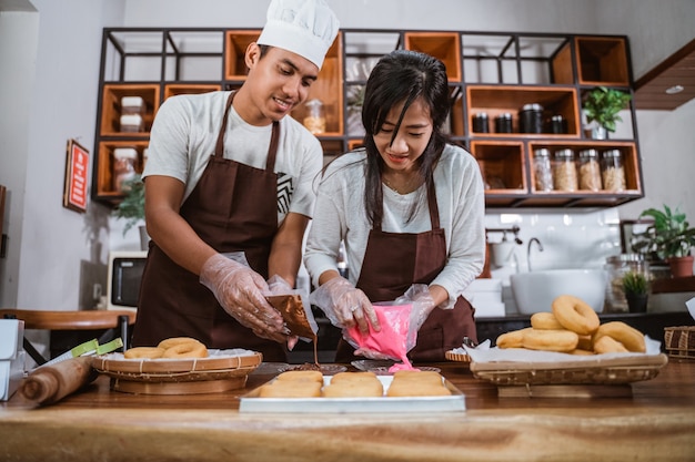 Asian chef preparing homemade donuts