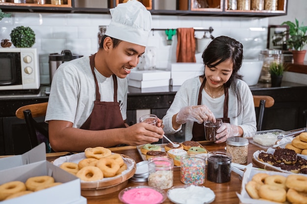 Asian chef preparing homemade donuts