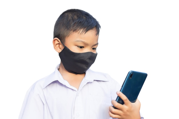 Asian child boy wearing black fabric mask on his face for prevent Covid-19 disease and corona virus.