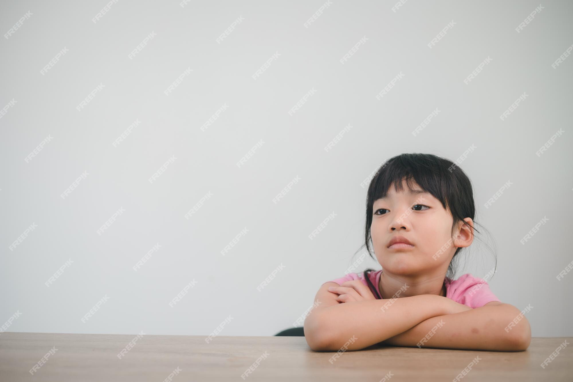 Premium Photo  Child girl sad profile face close up with hands on cheek.