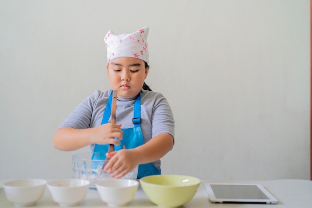 Asian children are learning to cook