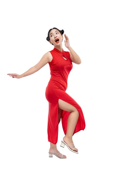 Asian Chinese woman in a cheongsam dress standing with an excited expression