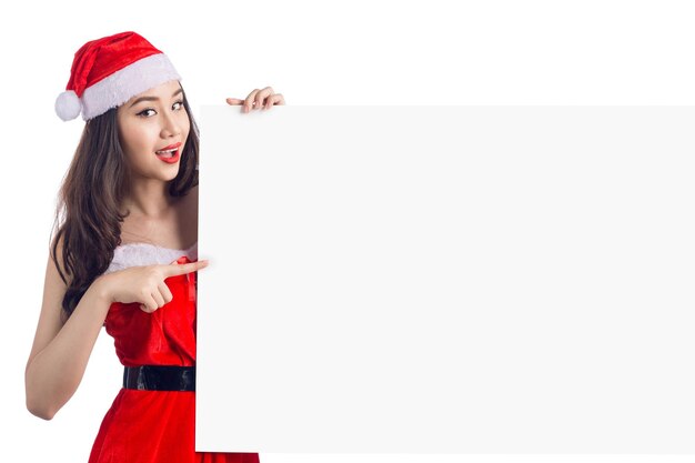 Asian Christmas girl with Santa Claus clothes holding blank sign isolated on white background