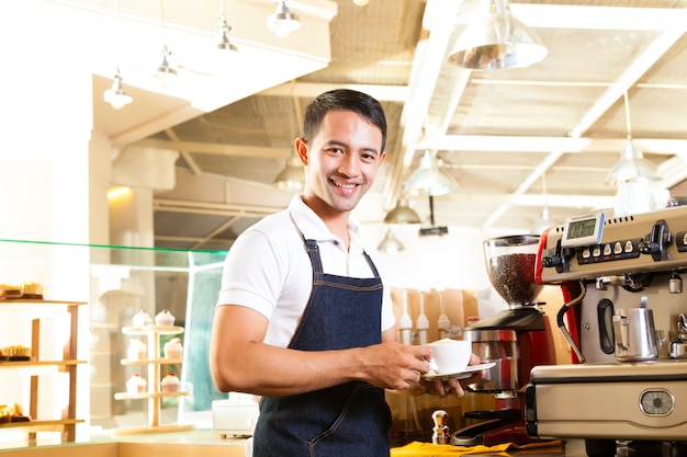 Asian Coffeeshop - barista presents coffee