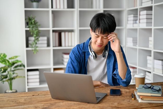 Asian college student sitting in the study room preparing for the exam