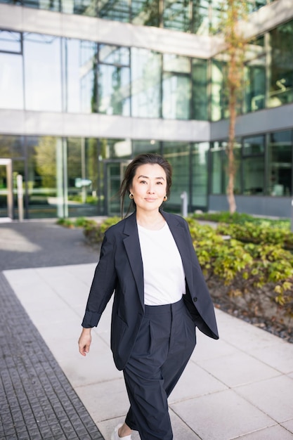 Asian confident business woman in suit walking Job work concept