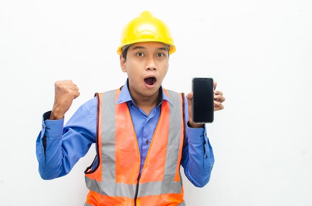 asian construction worker holding a phone with shocked, surprised, and amazed expressions.