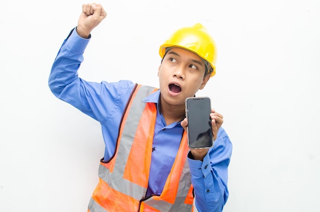 asian construction worker holding a phone with shocked, surprised, and amazed expressions.