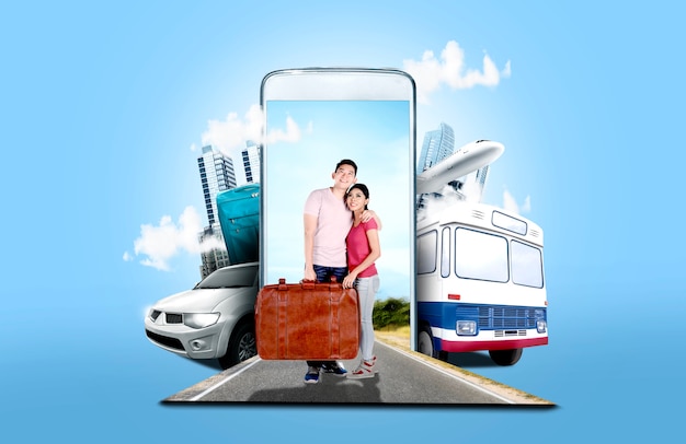 Asian couple carrying suitcase bag standing on the street