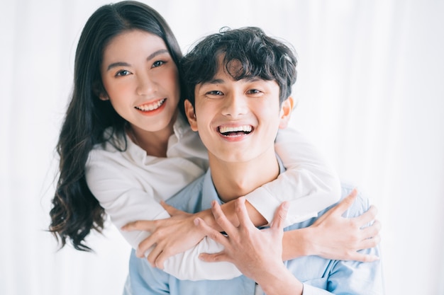 Asian couple happily embracing each other