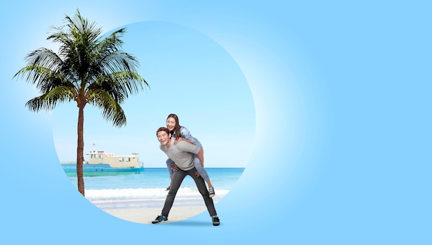 Asian couple having fun with sandy beach background