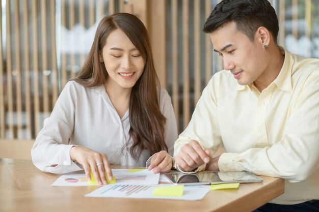 Asian couple is calculating income and expenses